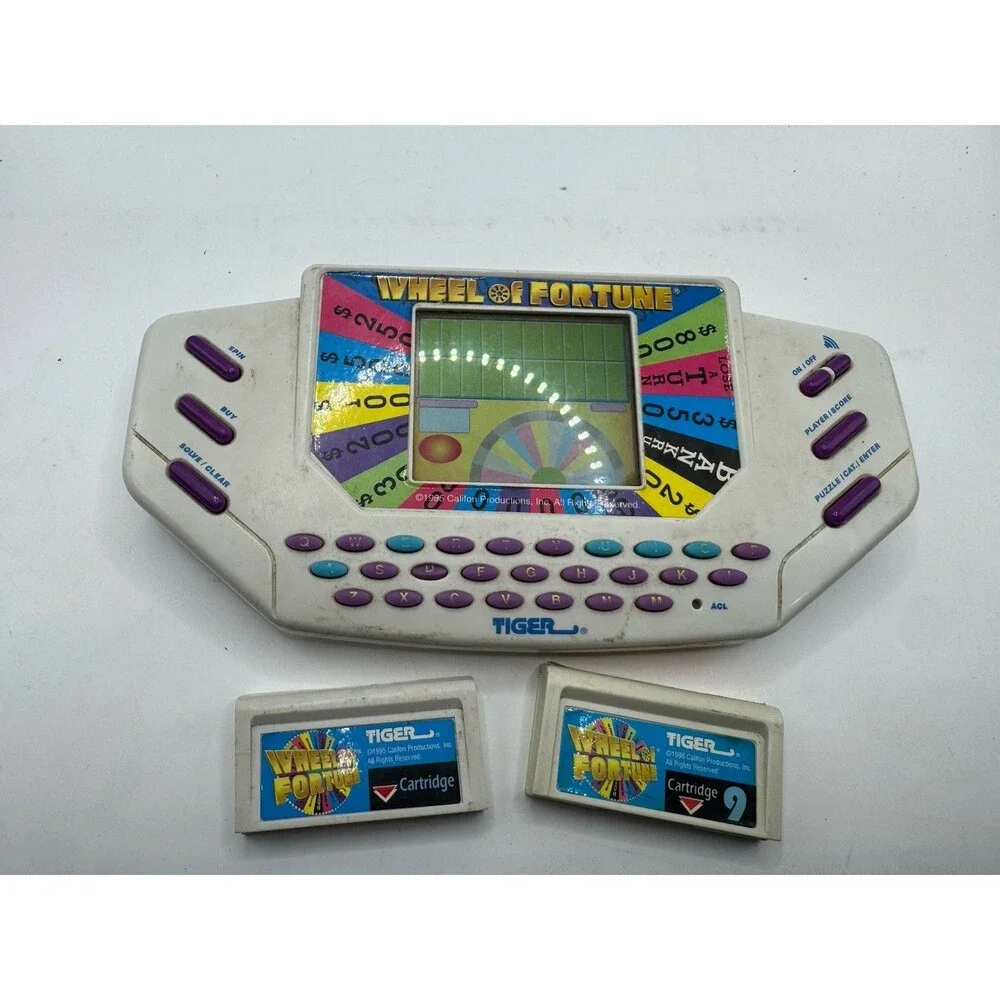 Tiger Electronics Wheel of Fortune Handheld Electronic game for parts or repair